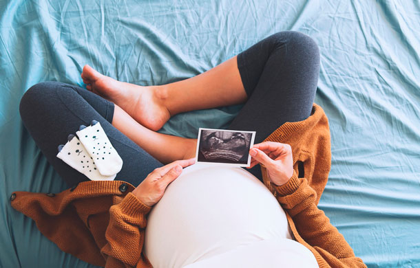 Pregnant Belly with ultrasound photo